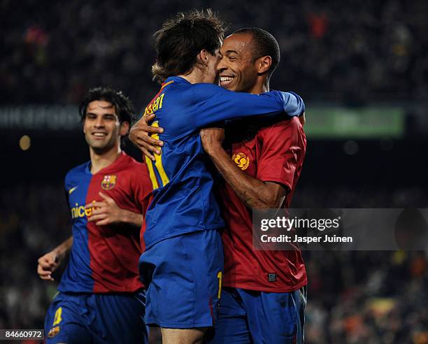 Thierry Henry of Barcelona celebrates scoring his sides opening goal with his teammate Bojan Krkic while flanked by Rafael Marquez during the Copa...