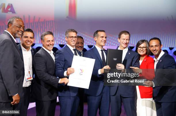 Chairman of Los Angeles 2028 Casey Wasserman and Los Angeles Mayor Eric Garcetti hold the IOC and LA2028 agreement during the131th IOC Session - 2024...