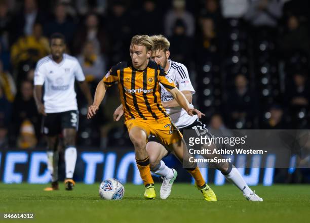 Hull City's Jarrod Bowen holds off the challenge from Fulham's Tim Ream during the Sky Bet Championship match between Fulham and Hull City at Craven...