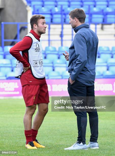 Steven Gerrard of Liverpool talks with his player Herbie Kane before the UEFA Champions League group E match between Liverpool FC and Sevilla FC at...