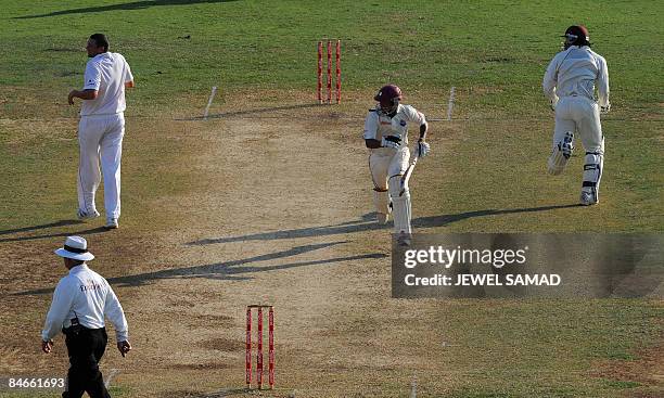 West Indies cricket team captain Chris Gayle and batsman Ramnaresh Sarwan take a run during the second day of the first Test match between England...