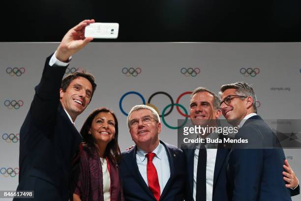 Paris 2024 Bid Co-Chair and 3-time Olympic Champion Tony Estanguet takes a selfie during a joint press conference between IOC, Paris 2024 and LA2028...