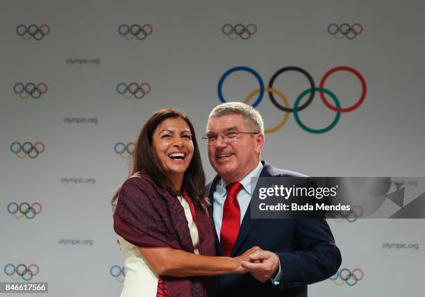 Anne Hidalgo and Thomas Bach laugh during a joint press conference between IOC, Paris 2024 and LA2028 during the131th IOC Session - 2024 & 2028...