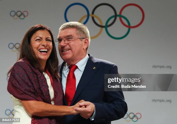 Anne Hidalgo and Thomas Bach laugh during a joint press conference between IOC, Paris 2024 and LA2028 during the131th IOC Session - 2024 & 2028...