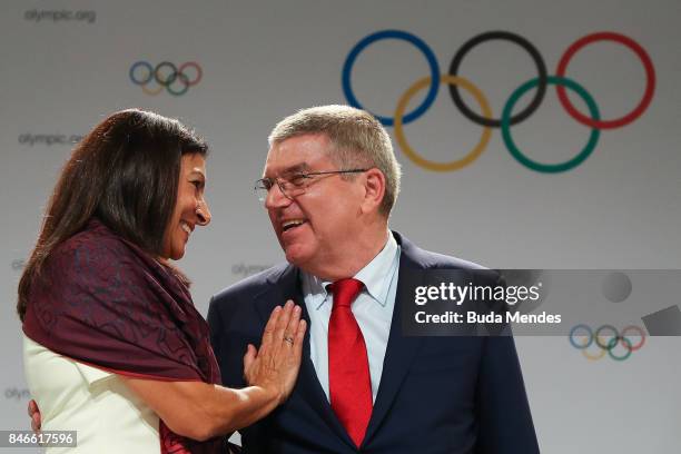 Anne Hidalgo and Thomas Bach laugh during a joint press conference between IOC, Paris 2024 and LA2028 during the131th IOC Session - 2024 & 2028...