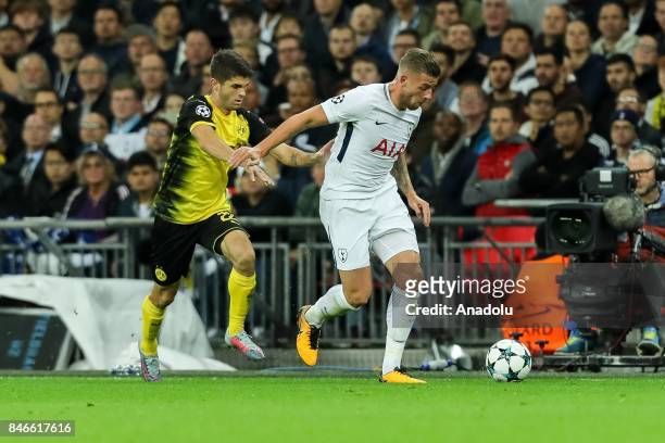 Christian Pulisic of Dortmund and Toby Alderweireld of Tottenham Hotspur battle for the ball during the UEFA Champions League group H match between...