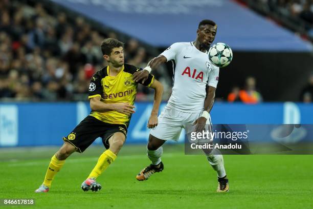 Christian Pulisic of Dortmund and Serge Aurier of Tottenham battle for the ball during the UEFA Champions League group H match between Tottenham...