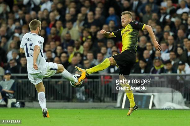 Eric Dier of Tottenham and Andrey Yarmolenko of Dortmund battle for the ball during the UEFA Champions League group H match between Tottenham Hotspur...