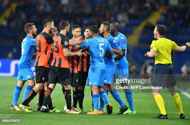 Napoli players and FC Shakhtar players react during the UEFA Champions League Group F football match between FC Shakhtar Donetsk and SSC Napoli at...