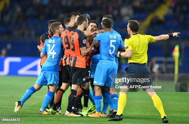 Napoli players and FC Shakhtar players react during the UEFA Champions League Group F football match between FC Shakhtar Donetsk and SSC Napoli at...