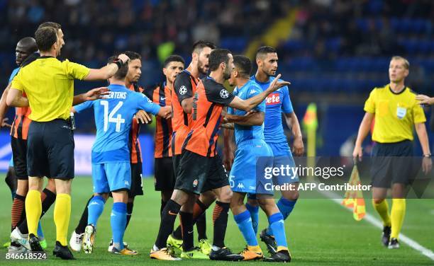 Napoli players and FC Shakhtar players react during the UEFA Champions League Group F football match between FC Shakhtar Donetsk and SSC Napoli at...