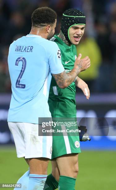 Kyle Walker of Manchester City greets goalkeeper of Manchester City Ederson Moraes following the UEFA Champions League match between Feyenoord...