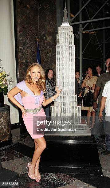 Mariah Carey lights up the Empire State Building to celebrate her new album "E=MC2" on April 25, 2008 in New York City.