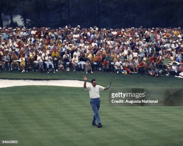 Bob Goalby reacts to a successful putt in front of a large gallery during the 1968 Masters Tournament at Augusta National Golf Club in April 1968 in...