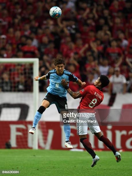 Yusuke Tasaka of Kawasaki Frontale and Rafael Silva of Urawa Red Diamonds compete for the ball during the AFC Champions League quarter final second...