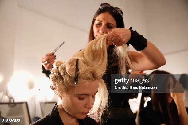 Model prepares backstage for the Marcel Ostertag fashion show during New York Fashion Week: The Shows at Gallery 3, Skylight Clarkson Sq on September...