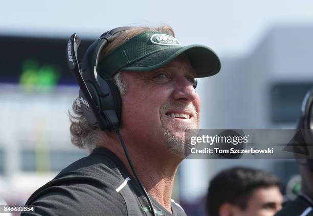 Outside linebackers coach Kevin Greene of the New York Jets looks on during NFL game action against the Buffalo Bills at New Era Field on September...