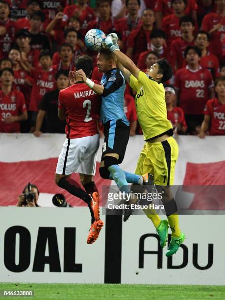 Jung Sung Ryong of Kawasaki Frontale saves the ball during the AFC Champions League quarter final second leg match between Urawa Red Diamonds and...