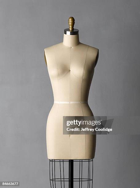 dress form on grey background - mannequin stockfoto's en -beelden