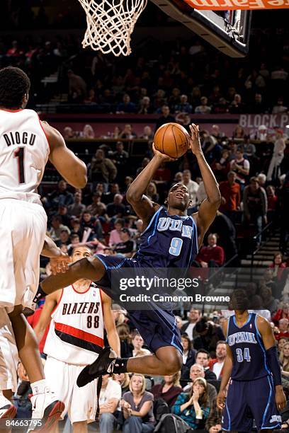 Ronnie Brewer of the Utah Jazz goes up for a shot against Ike Diogu of the Portland Trail Blazers during the game at The Rose Garden on January 31,...