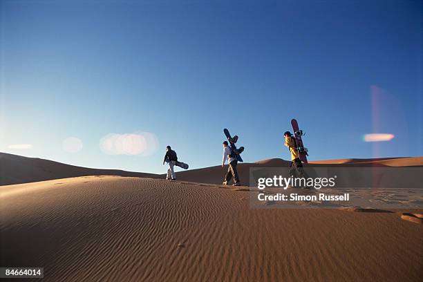sand-boarding in the sahara - sand boarding stock pictures, royalty-free photos & images