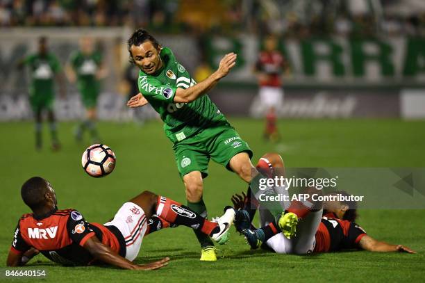 Apodi of Brazil's Chapecoense vies for the ball with Juan and Willian Arao of Brazil's Flamengo during their 2017 Copa Sudamericana football match...