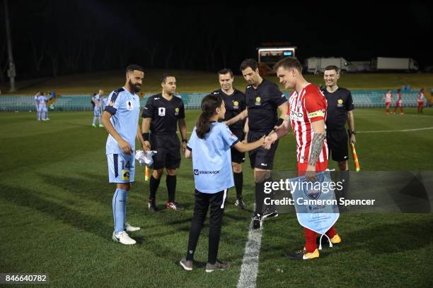 Alex Brosque of Sydney FC and Michael Jakobsen of City FC toss the coin during the FFA Cup Quarter Final match between Sydney FC and Melbourne City...