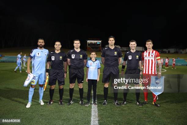 Alex Brosque of Sydney FC and Michael Jakobsen of City FC toss the coin during the FFA Cup Quarter Final match between Sydney FC and Melbourne City...