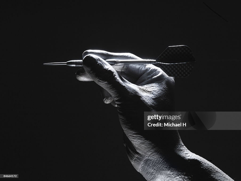 The silver hand which gives up a dart