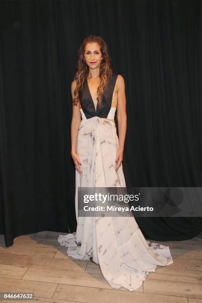 Actress/designer, Alysia Reiner, poses backstage at the Livari By Alysia Reiner, Claudine De Sola & Tabitha St. Bernard-Jacobs fashion show during...