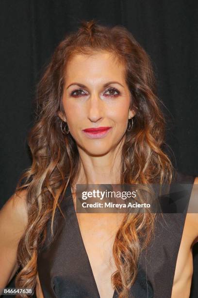 Actress/designer, Alysia Reiner, poses backstage at the Livari By Alysia Reiner, Claudine De Sola & Tabitha St. Bernard-Jacobs fashion show during...