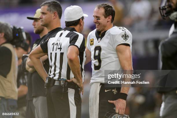 Drew Brees of the New Orleans Saints speaks with referee Gene Steratore before the game against the Minnesota Vikings on September 11, 2017 at U.S....
