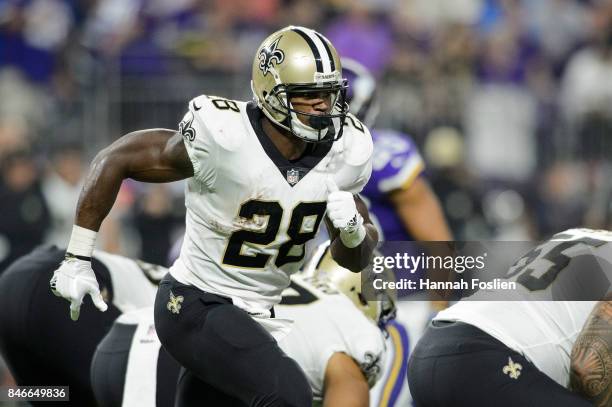 Adrian Peterson of the New Orleans Saints runs behind the line of scrimmage during the game against the Minnesota Vikings on September 11, 2017 at...