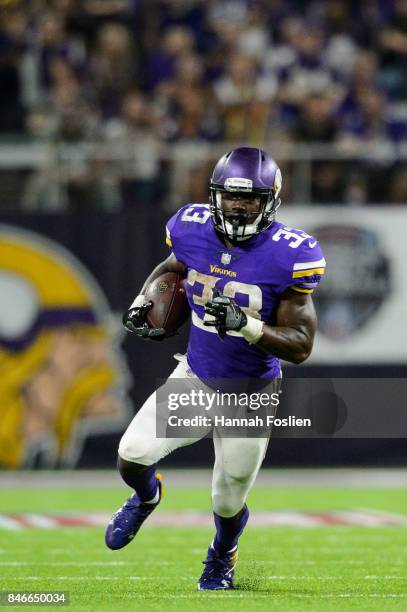 Dalvin Cook of the Minnesota Vikings carries the ball against the New Orleans Saints during the game on September 11, 2017 at U.S. Bank Stadium in...