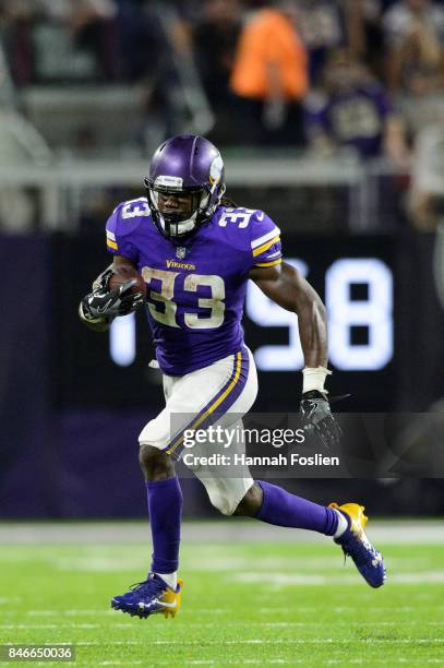 Dalvin Cook of the Minnesota Vikings carries the ball against the New Orleans Saints during the game on September 11, 2017 at U.S. Bank Stadium in...