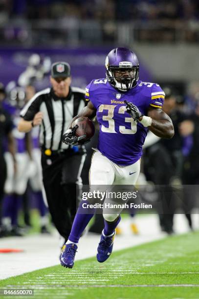 Dalvin Cook of the Minnesota Vikings carries the ball against the New Orleans Saints during the game on September 11, 2017 at U.S. Bank Stadium in...