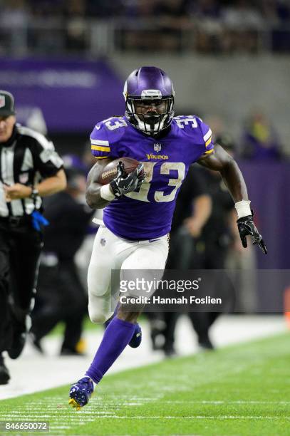Dalvin Cook of the Minnesota Vikings carries the ball against the New Orleans Saints during the game on September 11, 2017 at U.S. Bank Stadium in...