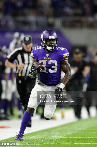 Dalvin Cook of the Minnesota Vikings carries the ball against the New Orleans Saints during the game on September 11, 2017 at U.S. Bank Stadium in...