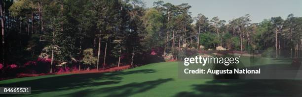 1990s: A wide-angle panoramic shot of the 13th hole during a 1990s Masters Tournament at Augusta National Golf Club in Augusta, Georgia.