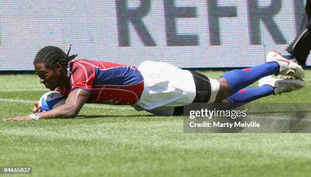Justin Boyd of the USA scores a try during the match between USA and Fiji on day one of the New Zealand International Sevens at Westpac Stadium on...