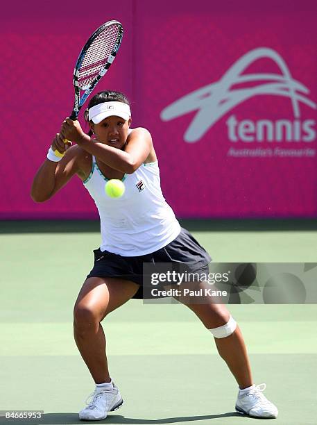 Hsuan Hwang of Chinese Taipei plays a return shot to Casey Dellacqua of Australia during day three of the Fed Cup Asia/Oceania Zone Group 1 & 2 match...