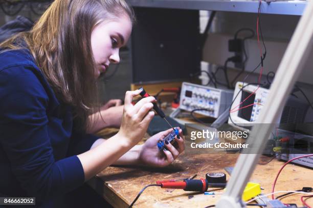 learning how to solder at a university courses - genius woman stock pictures, royalty-free photos & images