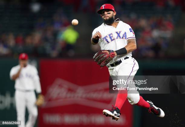 Rougned Odor of the Texas Rangers fields a ground ball hit by Danny Valencia of the Seattle Mariners for an out in the top of the fifth inning at...