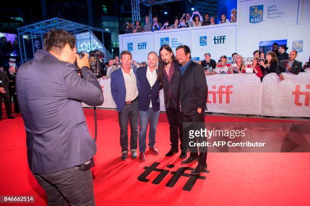 The members of the Canadian band The Tragically Hip, Gord Sinclair, Johnny Fay, Rob Baker and Paul Langlois, pose for a photo during the premiere of...