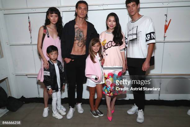 Designer Liu Jia poses with models backstage for the Jia Liu fashion show during New York Fashion Week: The Shows at Gallery 2, Skylight Clarkson Sq...