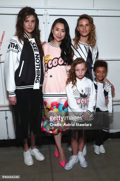 Designer Liu Jia poses with models backstage for the Jia Liu fashion show during New York Fashion Week: The Shows at Gallery 2, Skylight Clarkson Sq...