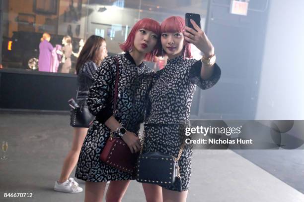 Models Aya Suzuki and Ami Suzuki attend Michael Kors and Google Celebrate new MICHAEL KORS ACCESS Smartwatches at ArtBeam on September 13, 2017 in...