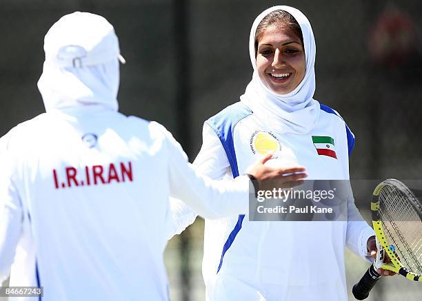 Madona Najarian and Shadi Tabatabaei of Iran celebrate a point during day three of the Fed Cup Asia/Oceania Zone Group 1 & 2 match between Singapore...