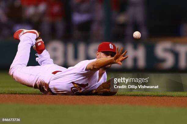 Paul DeJong of the St. Louis Cardinals flips the ball to second base against the Cincinnati Reds in the fifth inning at Busch Stadium on September...
