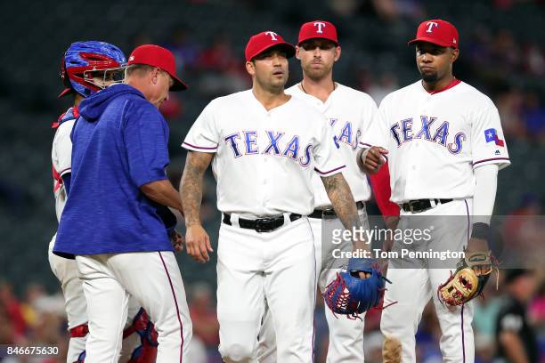 Matt Bush of the Texas Rangers walks off the mound after being pulled from the game against the Seattle Mariners in the top of the seventh inning at...